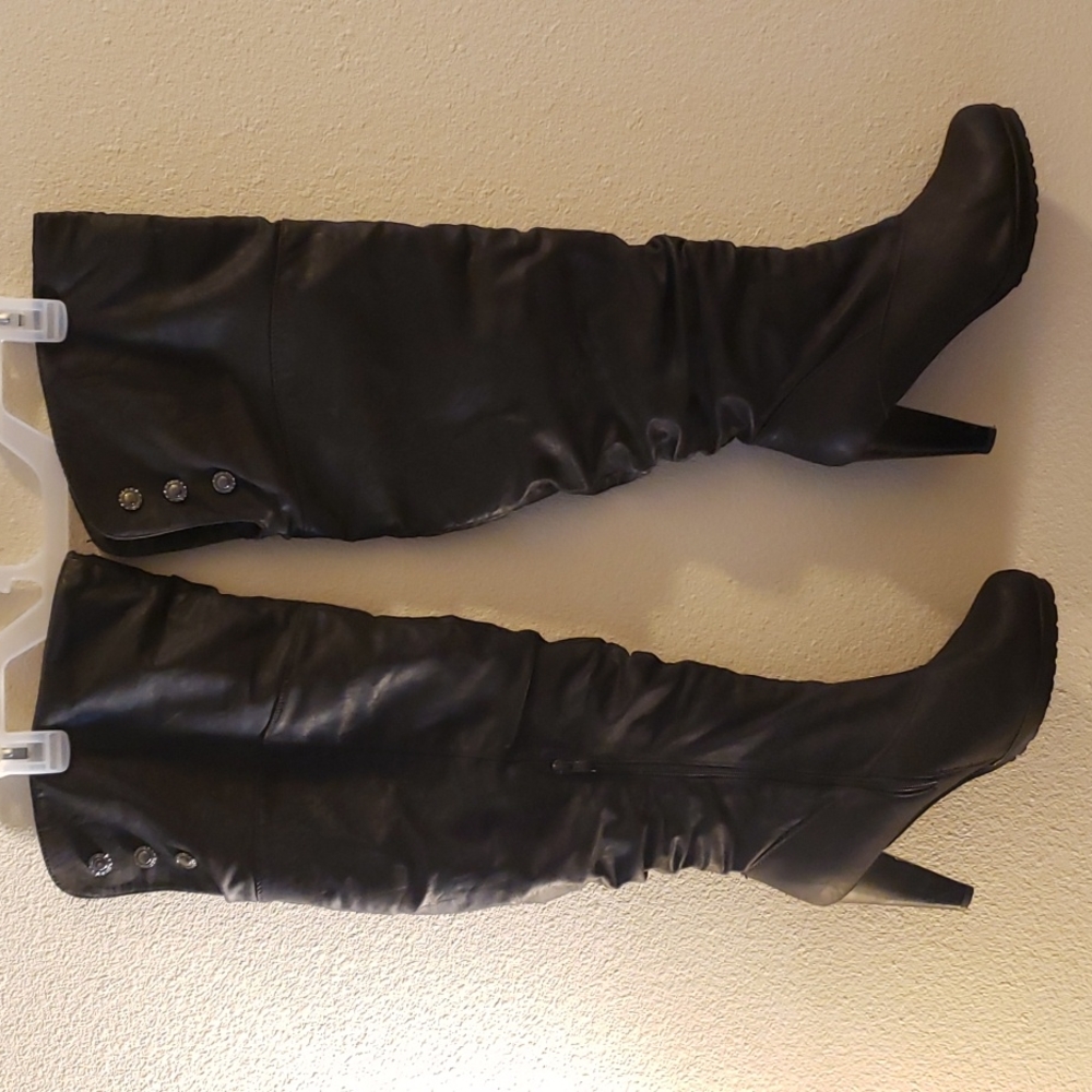 Black knee high boots 3 inch heels.